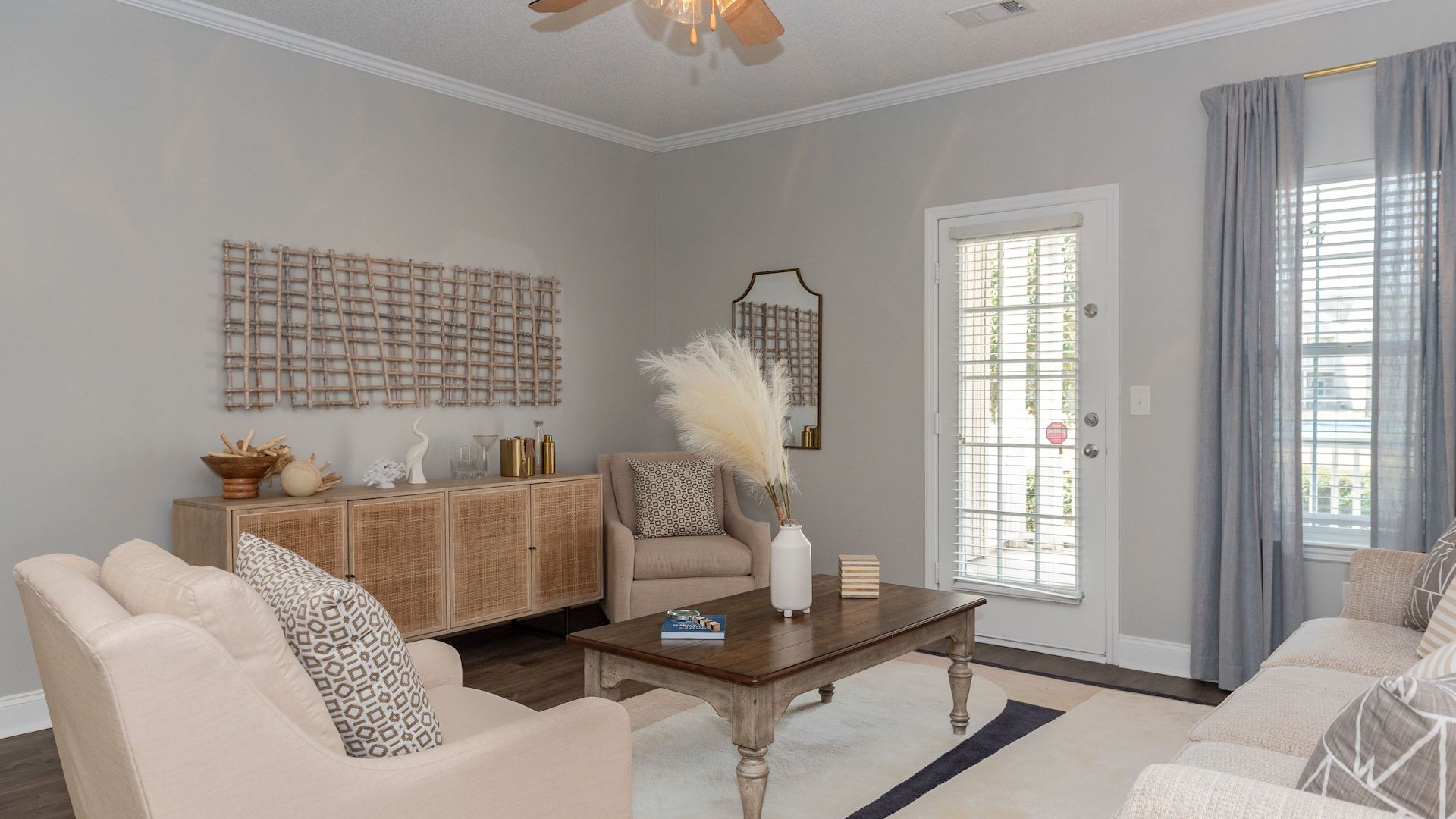 Cozy living room with plush seating and chic decor at Hawthorne Meadowview in Warner Robins, GA